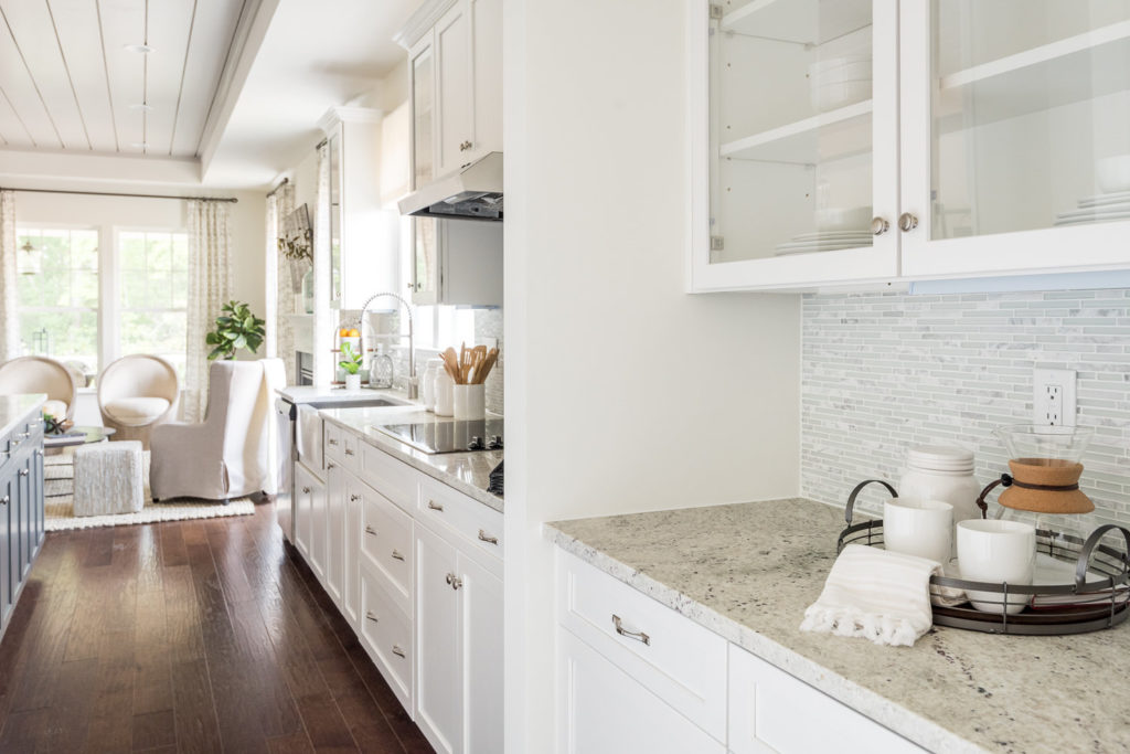 model home kitchen bulters pantry storage hardwood floors white natural light single level living