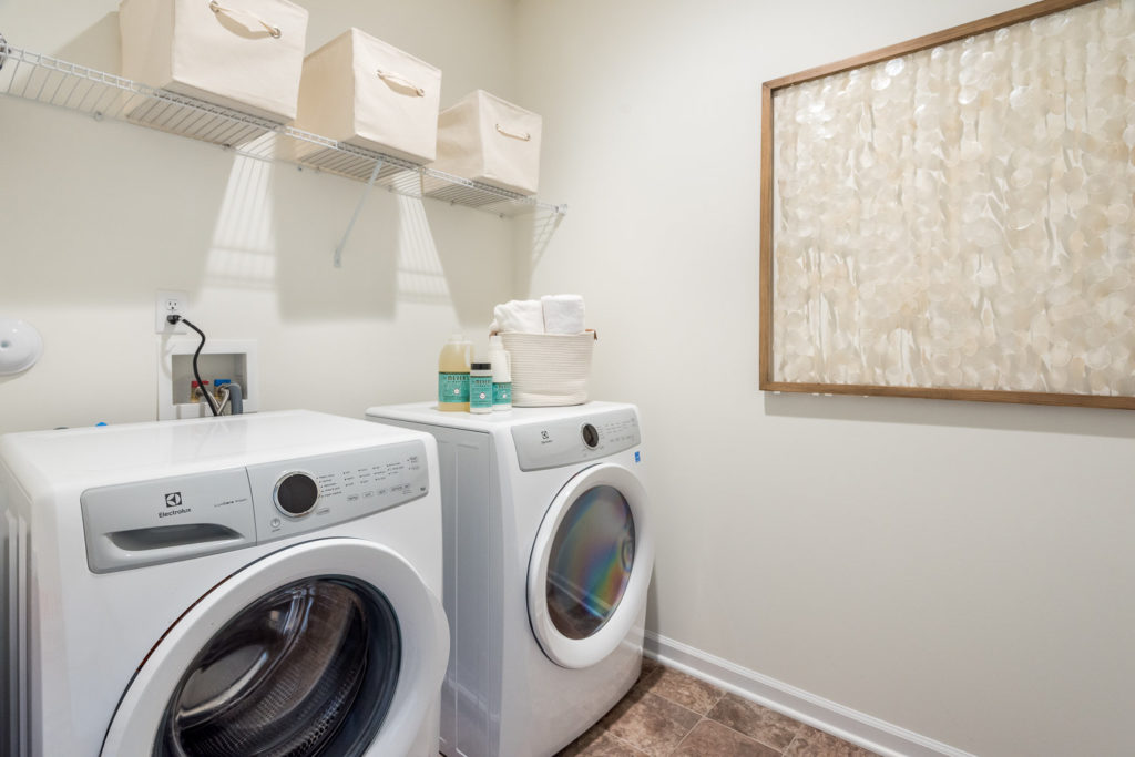 55+ living laundry room model home